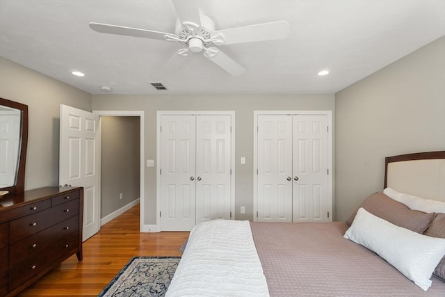 63 Prospect St Unit 2, Woburn, MA 01801 - bedroom with multiple closets, recessed lighting, light wood-type flooring, and a ceiling fan