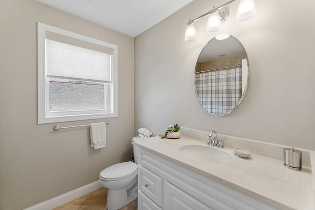 63 Prospect St Unit 2, Woburn, MA 01801 - bathroom with vanity, toilet, tile patterned floors, baseboards, and curtained shower