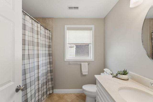63 Prospect St Unit 2, Woburn, MA 01801 - bathroom featuring toilet, vanity, baseboards, tile patterned flooring, and curtained shower