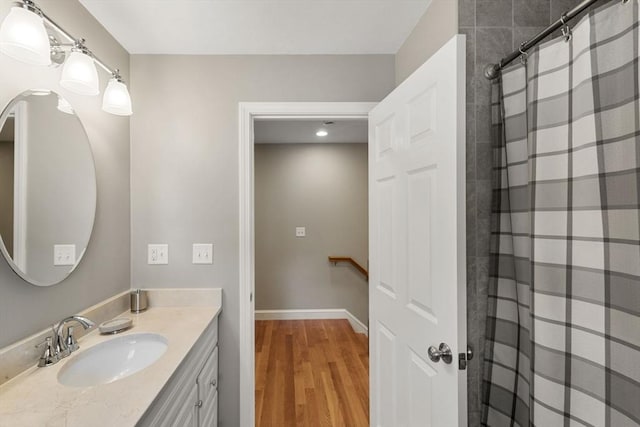 63 Prospect St Unit 2, Woburn, MA 01801 - bathroom featuring vanity, wood finished floors, curtained shower, and recessed lighting