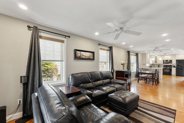 63 Prospect St Unit 2, Woburn, MA 01801 - living room featuring a ceiling fan, recessed lighting, light wood finished floors, and baseboards