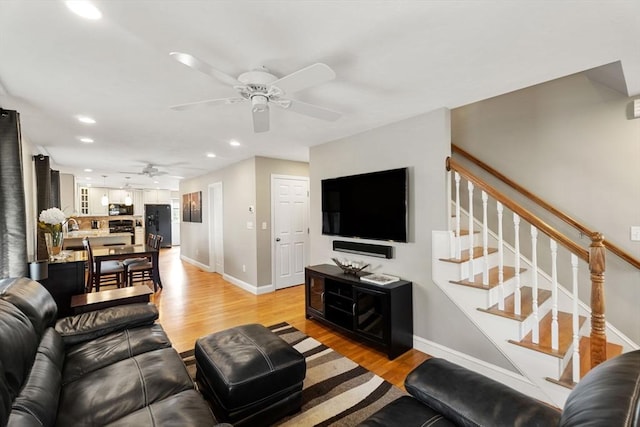 63 Prospect St Unit 2, Woburn, MA 01801 - living room with a ceiling fan, light wood-style floors, baseboards, recessed lighting, and stairs