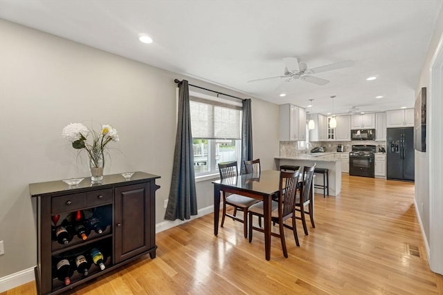 63 Prospect St Unit 2, Woburn, MA 01801 - dining area with ceiling fan, light wood finished floors, baseboards, and recessed lighting