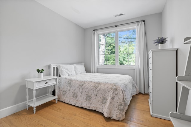 bedroom with light hardwood / wood-style floors