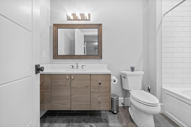 full bathroom featuring vanity, tiled shower / bath, toilet, and tile patterned floors