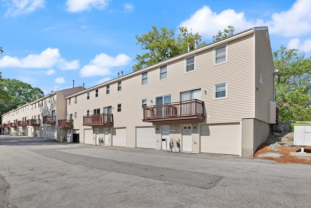 126 Willard St Unit D, Lowell, MA 01850 - view of building exterior with an attached garage and a residential view