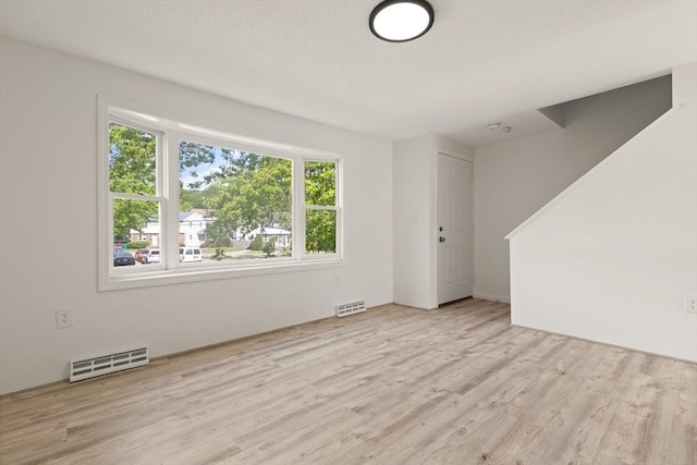 126 Willard St Unit D, Lowell, MA 01850 - unfurnished living room featuring wood finished floors