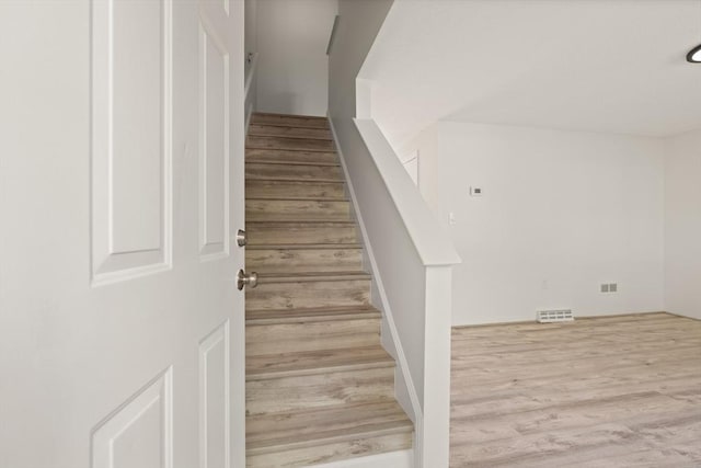 126 Willard St Unit D, Lowell, MA 01850 - stairway featuring wood finished floors
