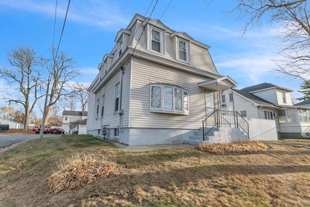 view of front of home with a front yard