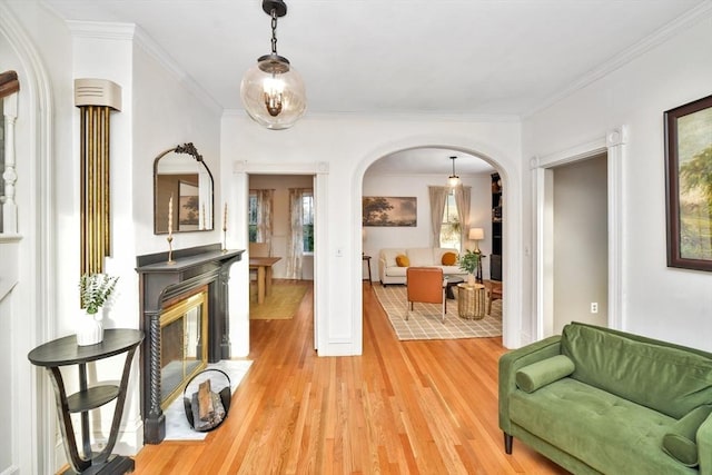 interior space featuring crown molding and wood-type flooring