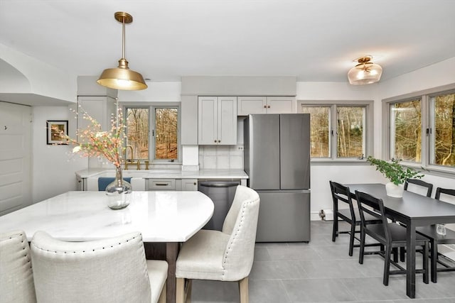 dining area featuring light tile patterned floors