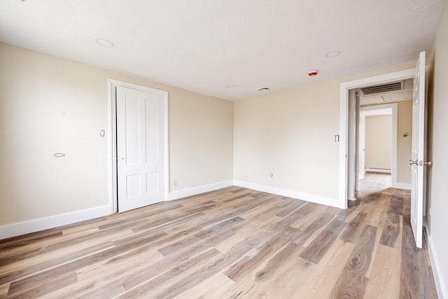 6 Nemasket St, Middleboro, MA 02346 - empty room with light wood-style floors, baseboards, and visible vents