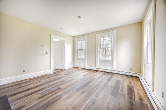 6 Nemasket St, Middleboro, MA 02346 - spare room featuring a baseboard radiator, light wood finished floors, and baseboards
