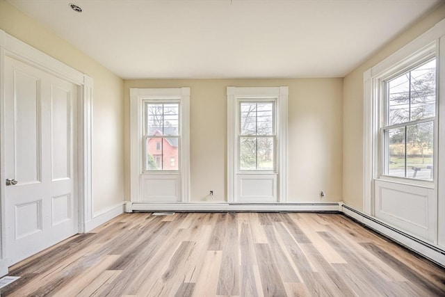 6 Nemasket St, Middleboro, MA 02346 - interior space with a baseboard radiator, light wood-type flooring, a baseboard heating unit, and baseboards