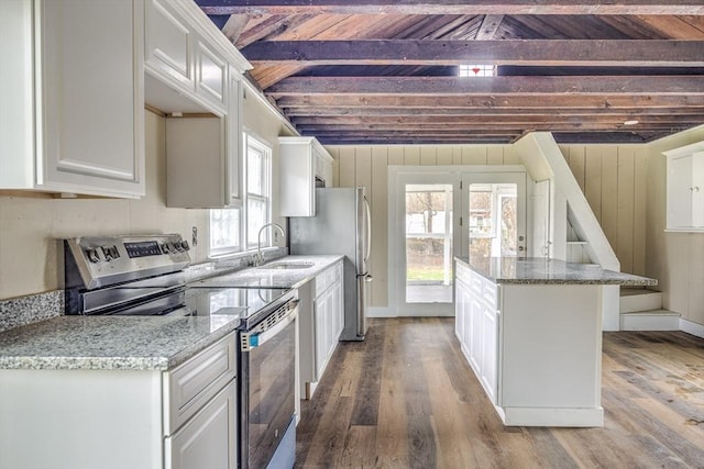 6 Nemasket St, Middleboro, MA 02346 - kitchen with electric range, wood finished floors, a center island, and white cabinets