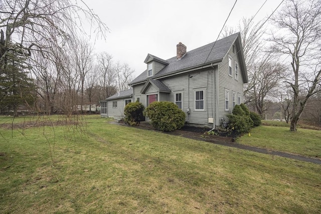 6 Nemasket St, Middleboro, MA 02346 - view of side of property featuring a yard, roof with shingles, and a chimney