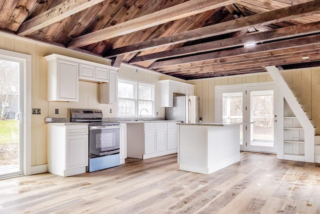 6 Nemasket St, Middleboro, MA 02346 - kitchen with white cabinets, light wood finished floors, and appliances with stainless steel finishes