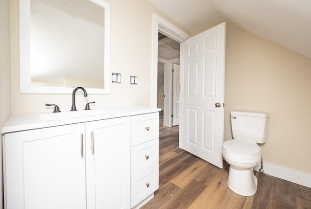 6 Nemasket St, Middleboro, MA 02346 - bathroom with baseboards, toilet, vanity, wood finished floors, and lofted ceiling