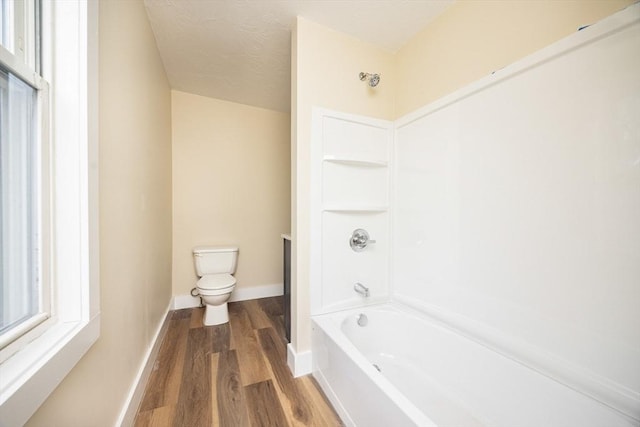 6 Nemasket St, Middleboro, MA 02346 - full bathroom featuring shower / bath combination, baseboards, toilet, and wood finished floors