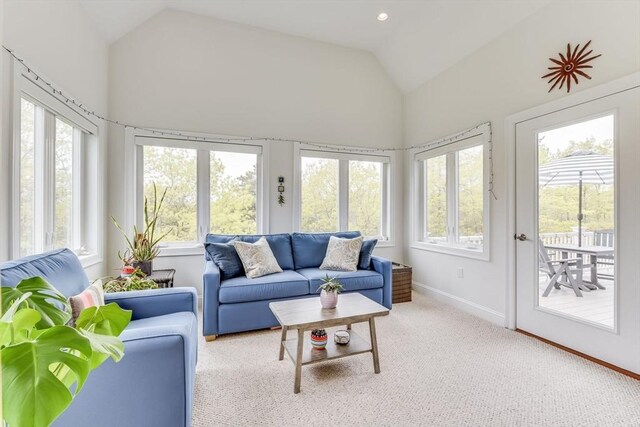 sunroom featuring vaulted ceiling