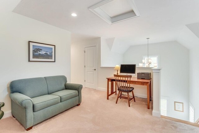 office space with vaulted ceiling, an inviting chandelier, and light carpet