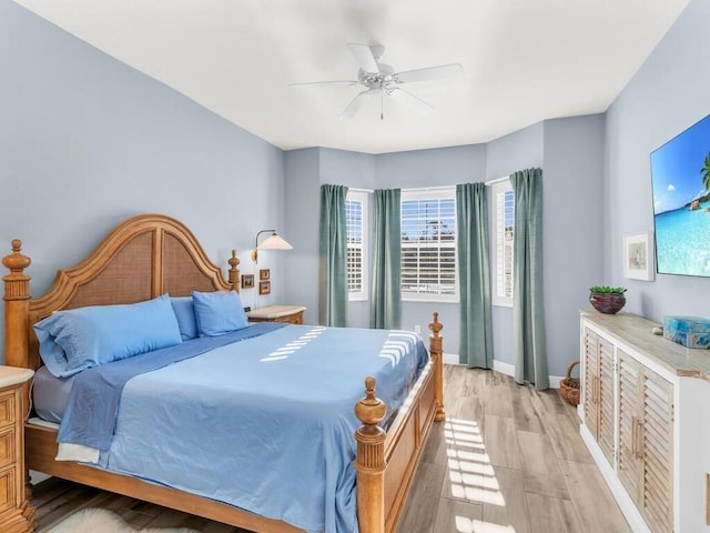 bedroom featuring light hardwood / wood-style floors and ceiling fan