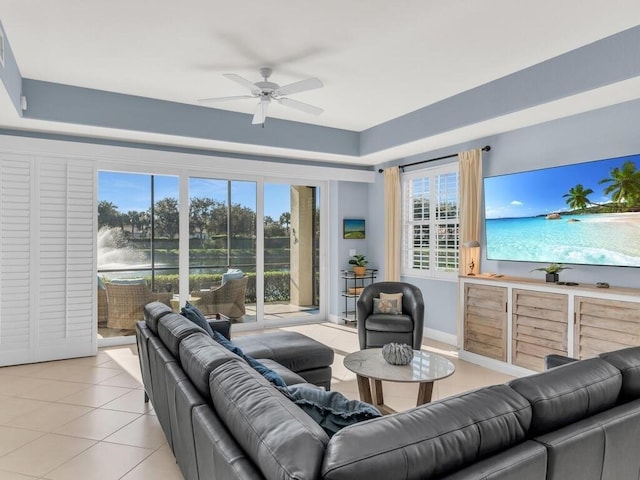 tiled living room featuring ceiling fan