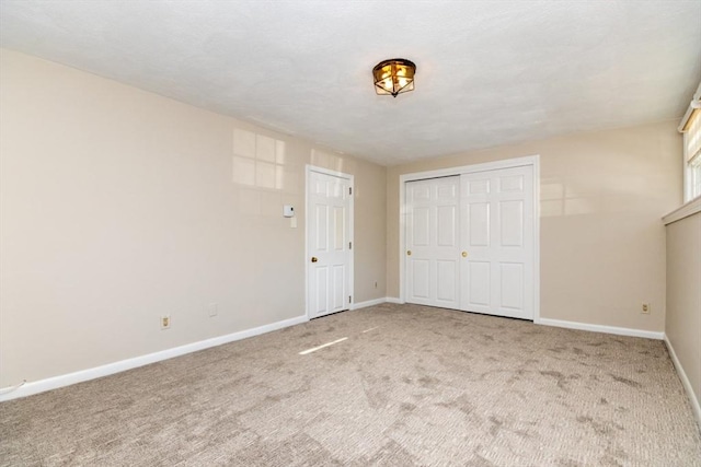 unfurnished bedroom with carpet and a closet