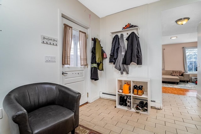 mudroom with baseboard heating and a baseboard radiator