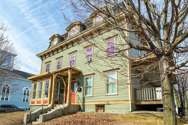 view of front of property with mansard roof