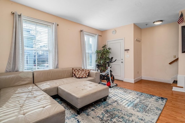 living room with baseboards and wood finished floors