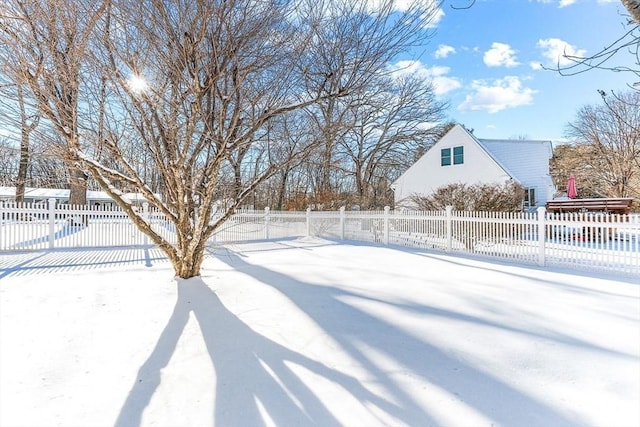 view of yard covered in snow