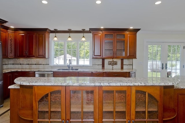 47 Avis Cir, Northampton, MA 01062 - kitchen with a sink, recessed lighting, backsplash, healthy amount of natural light, and french doors