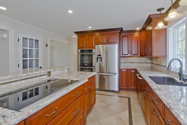 47 Avis Cir, Northampton, MA 01062 - kitchen with appliances with stainless steel finishes, a sink, recessed lighting, decorative backsplash, and light stone countertops