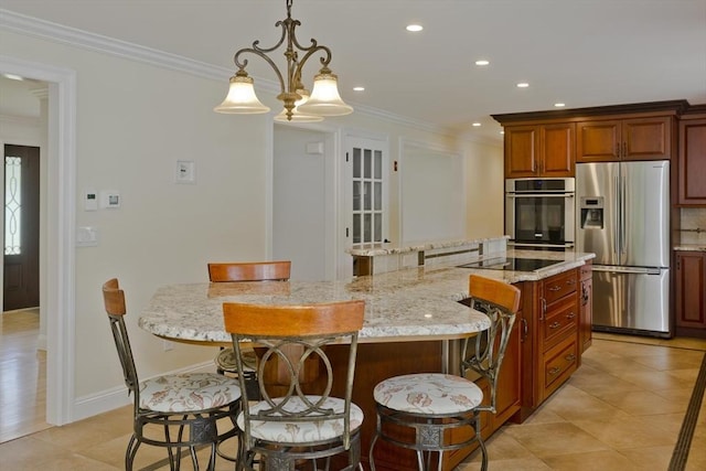 47 Avis Cir, Northampton, MA 01062 - kitchen with stainless steel appliances, a center island, a breakfast bar, recessed lighting, and ornamental molding