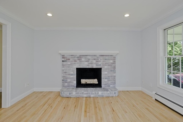 47 Avis Cir, Northampton, MA 01062 - unfurnished living room with a baseboard radiator, hardwood / wood-style floors, crown molding, baseboards, and a brick fireplace
