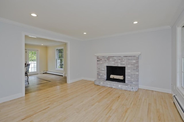 47 Avis Cir, Northampton, MA 01062 - unfurnished living room with baseboard heating, hardwood / wood-style flooring, baseboards, ornamental molding, and a brick fireplace