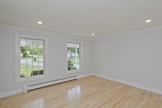 47 Avis Cir, Northampton, MA 01062 - spare room with a baseboard radiator, ornamental molding, wood finished floors, baseboards, and recessed lighting