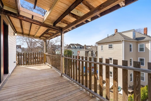 wooden terrace featuring a residential view