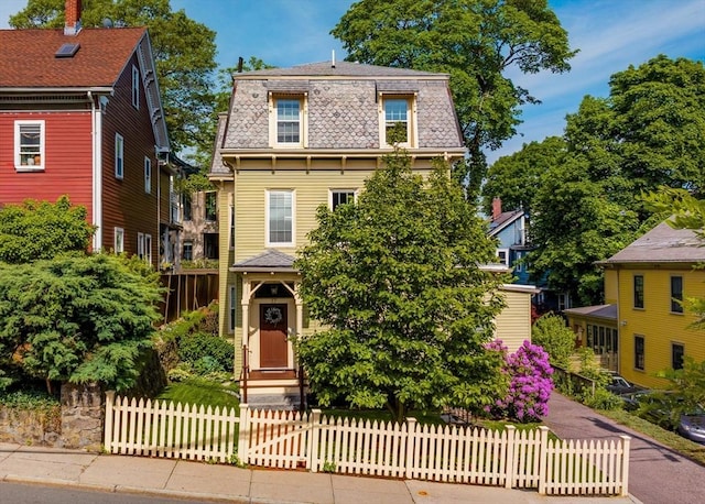 17 Rockview St Unit 1, Boston, MA 02130 - victorian home with mansard roof, a high end roof, and a fenced front yard