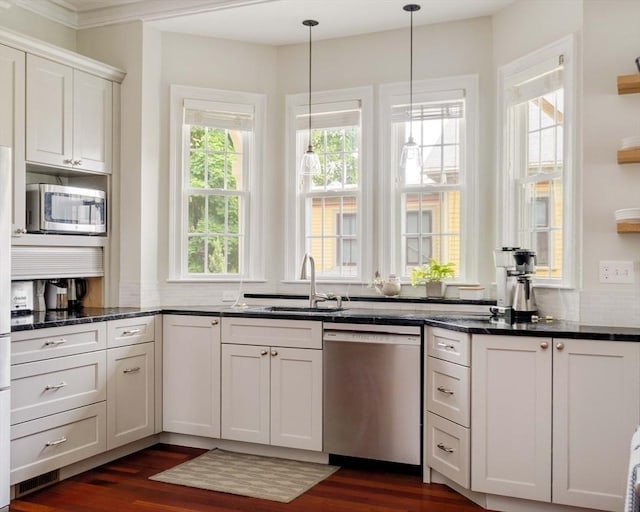 17 Rockview St Unit 1, Boston, MA 02130 - kitchen featuring appliances with stainless steel finishes, a sink, dark wood-style floors, and decorative light fixtures