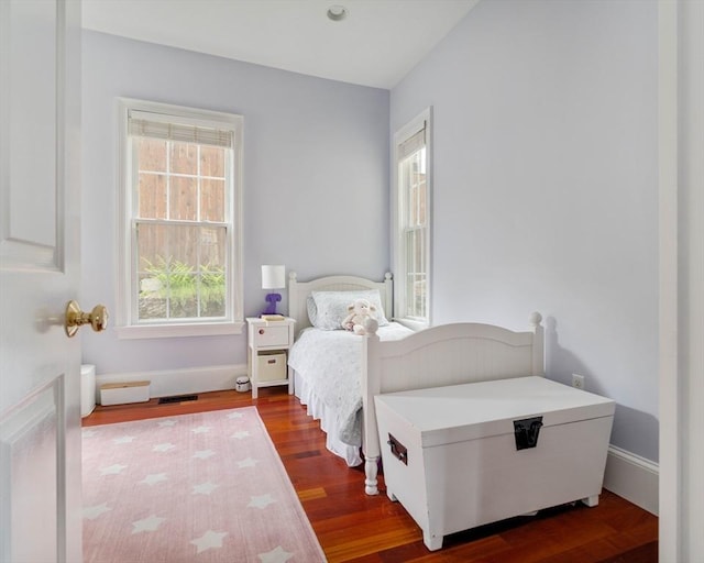 17 Rockview St Unit 1, Boston, MA 02130 - bedroom featuring dark wood-style flooring, multiple windows, and baseboards