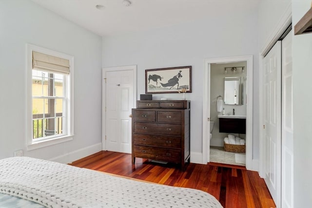 17 Rockview St Unit 1, Boston, MA 02130 - bedroom with wood finished floors, baseboards, a closet, and ensuite bath