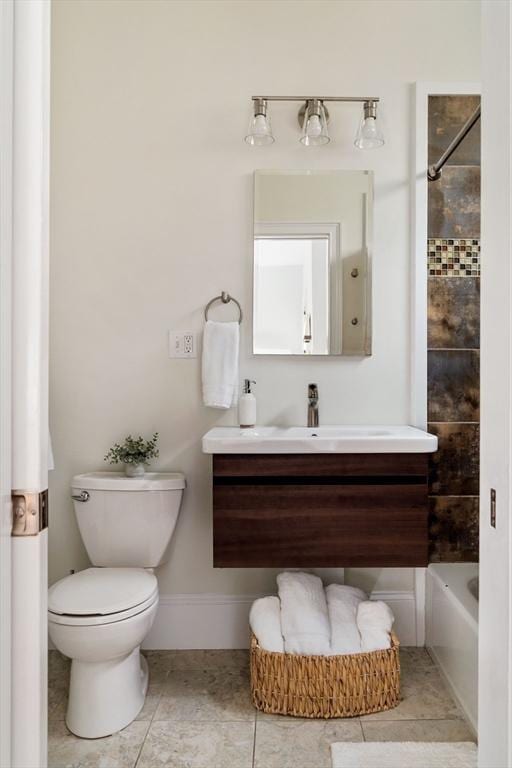 17 Rockview St Unit 1, Boston, MA 02130 - bathroom with vanity, toilet, tile patterned floors, shower / bathtub combination, and baseboards