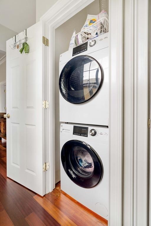 17 Rockview St Unit 1, Boston, MA 02130 - laundry area featuring estacked washer and dryer and wood finished floors