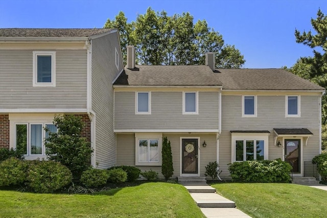 1702 Lewis O Gray Dr Unit 1702, Saugus, MA 01906 - view of front of house with a chimney, a front yard, and entry steps
