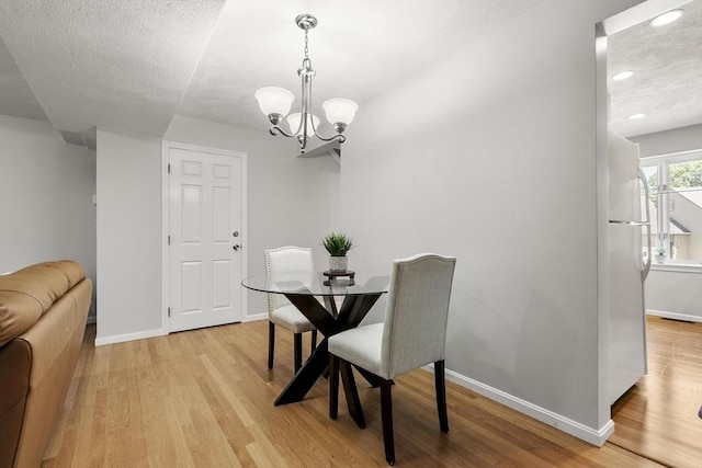 1702 Lewis O Gray Dr Unit 1702, Saugus, MA 01906 - dining space with a chandelier, light wood finished floors, recessed lighting, and a textured ceiling