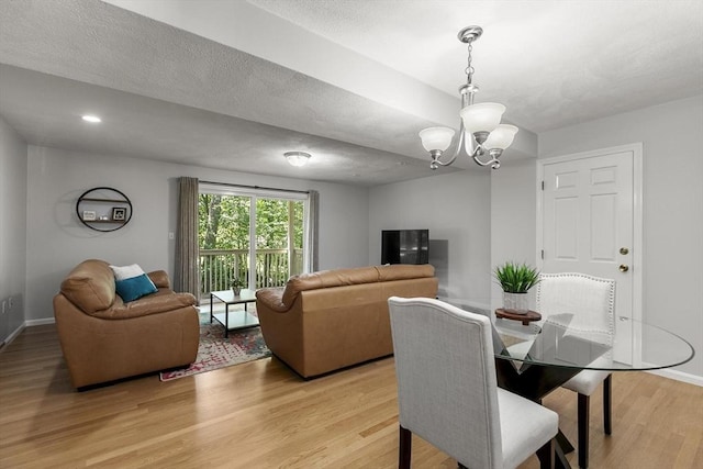 1702 Lewis O Gray Dr Unit 1702, Saugus, MA 01906 - dining room with light wood finished floors and a chandelier
