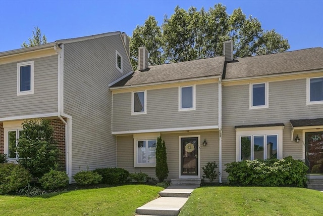 1702 Lewis O Gray Dr Unit 1702, Saugus, MA 01906 - view of front of home featuring a chimney and a front lawn