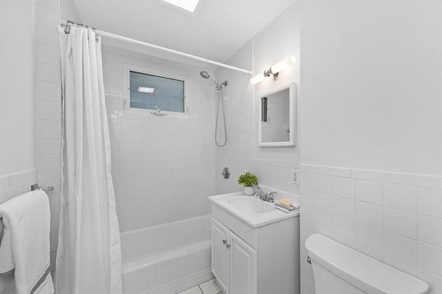 85 Holworthy Unit 85, Cambridge, MA 02138 - bathroom featuring tile walls, vanity, shower / bathtub combination with curtain, and a wainscoted wall